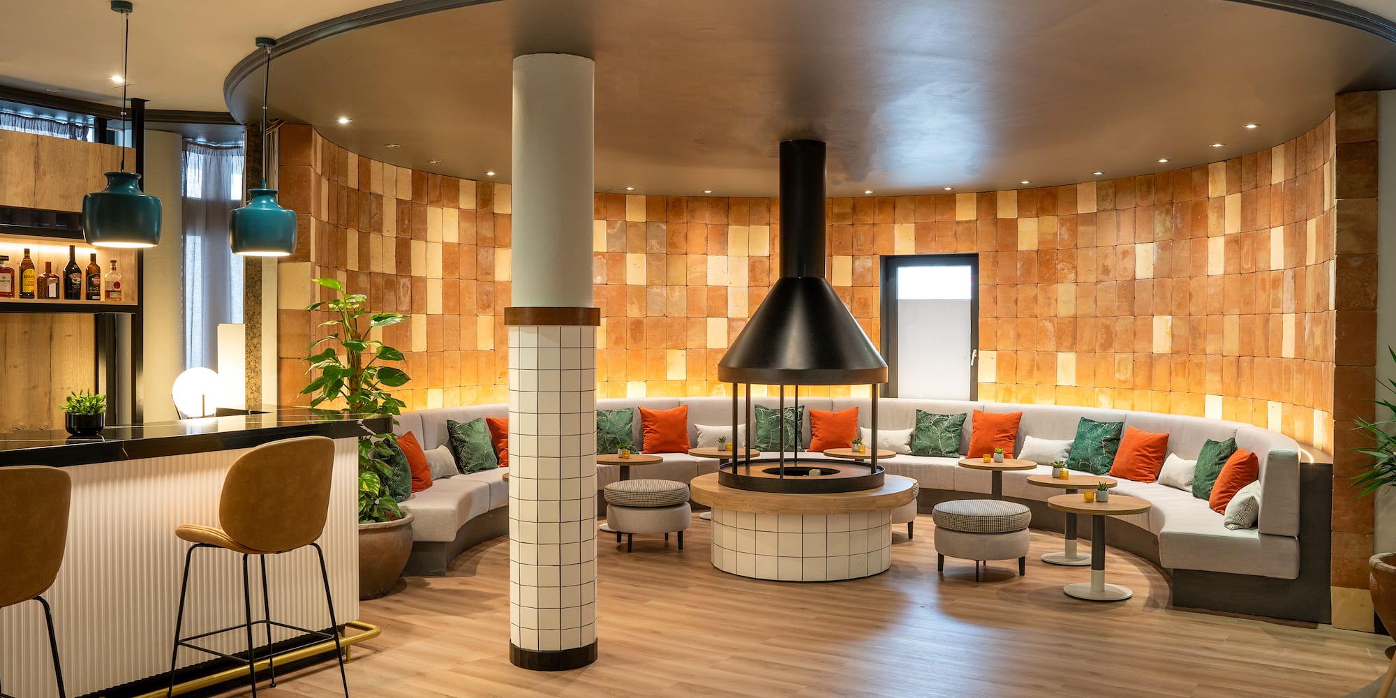 a room with a round table and chairs