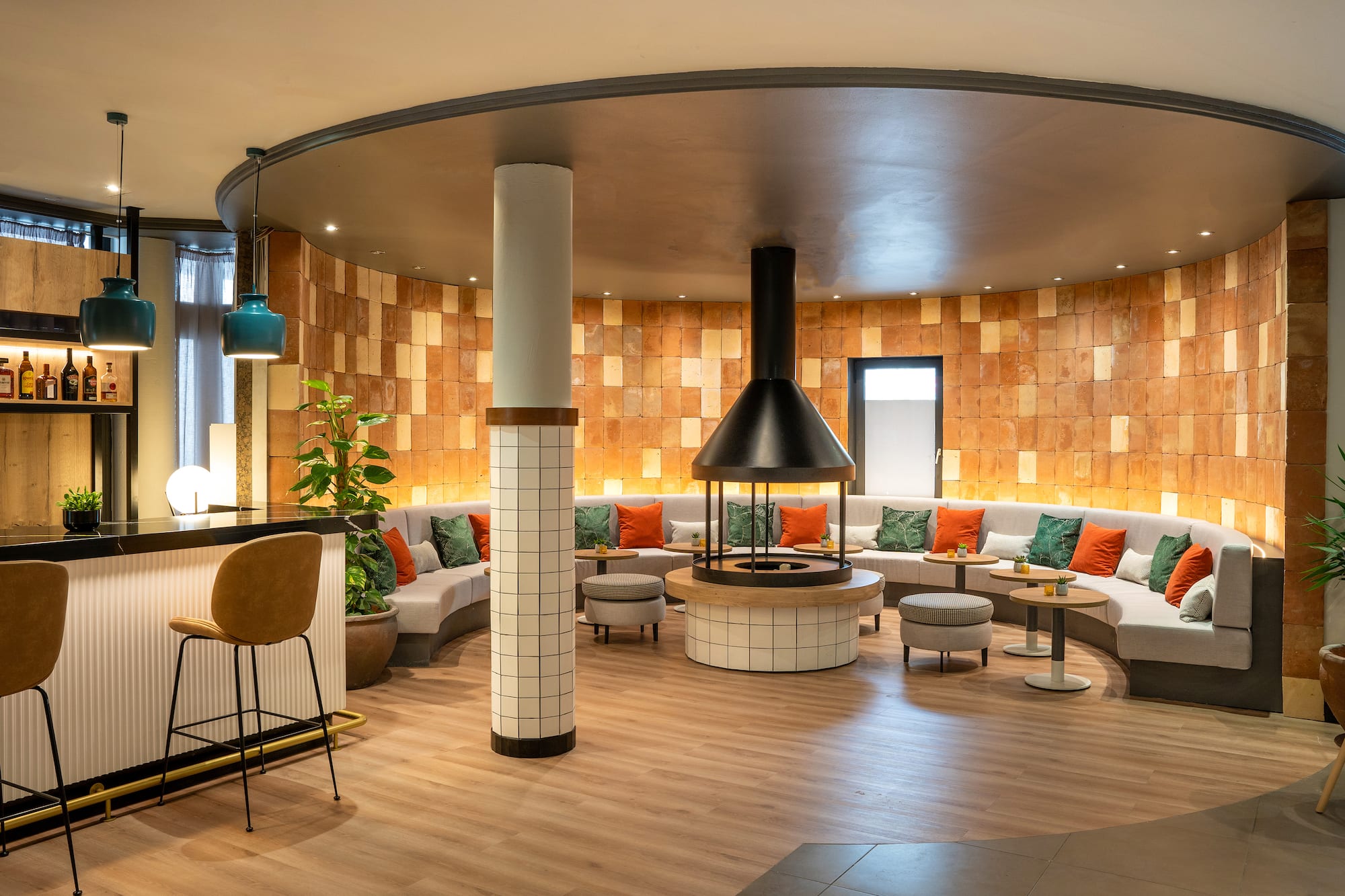 a room with a round table and chairs