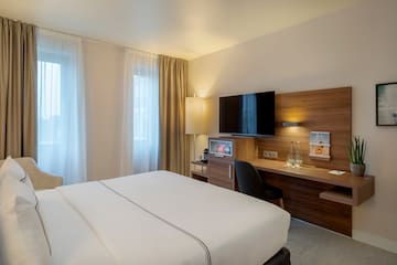 a room with a bed and a desk