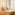 Luxurious king bed hotel room with tufted headboard, warm lamps, and tropical view.