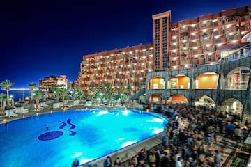 a large group of people outside a pool