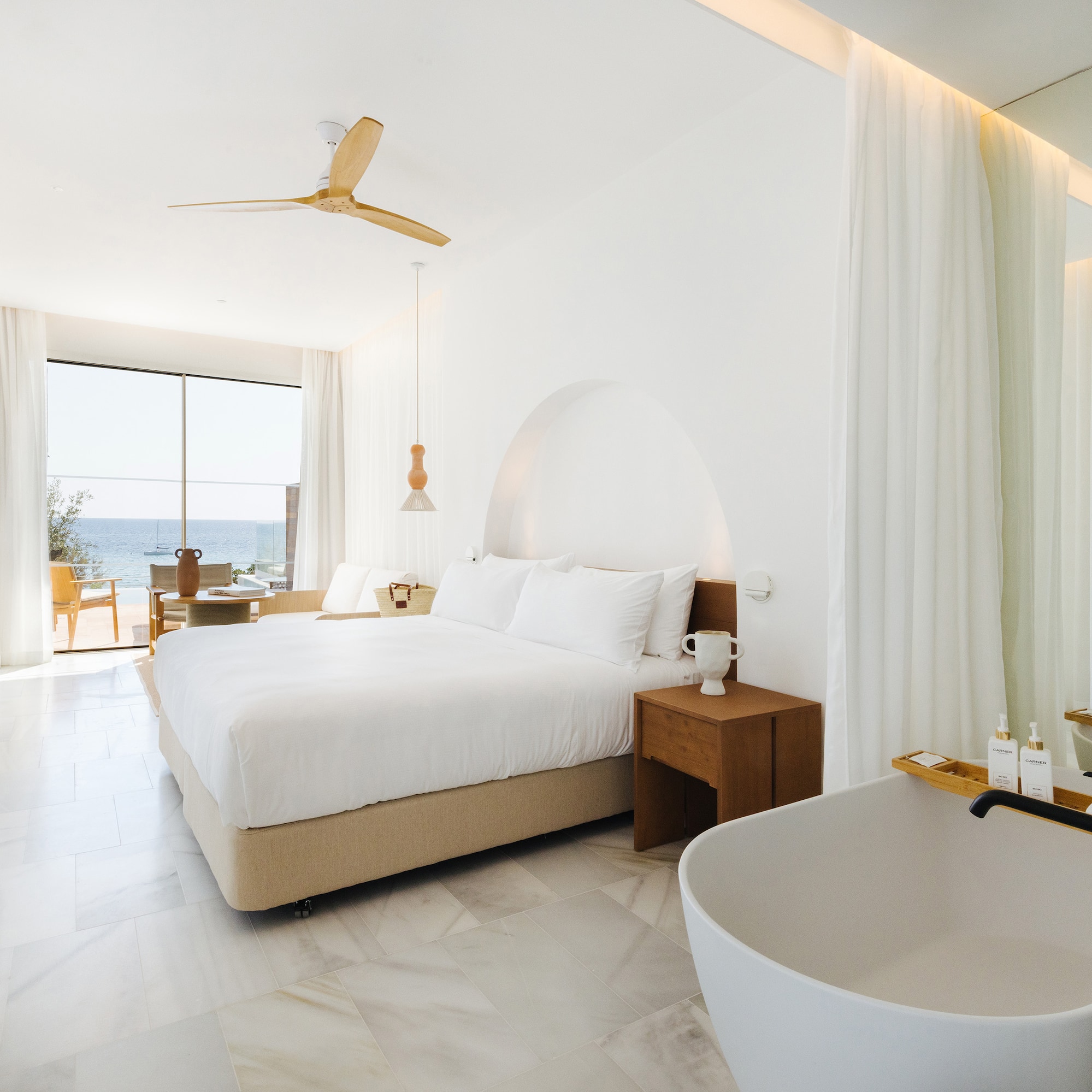 a room with a bed and bathtub