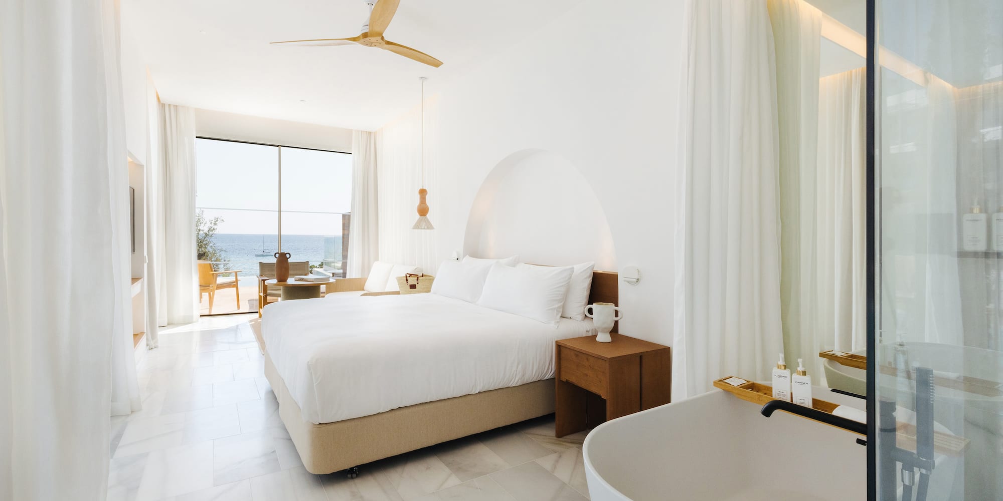 a room with a bed and bathtub