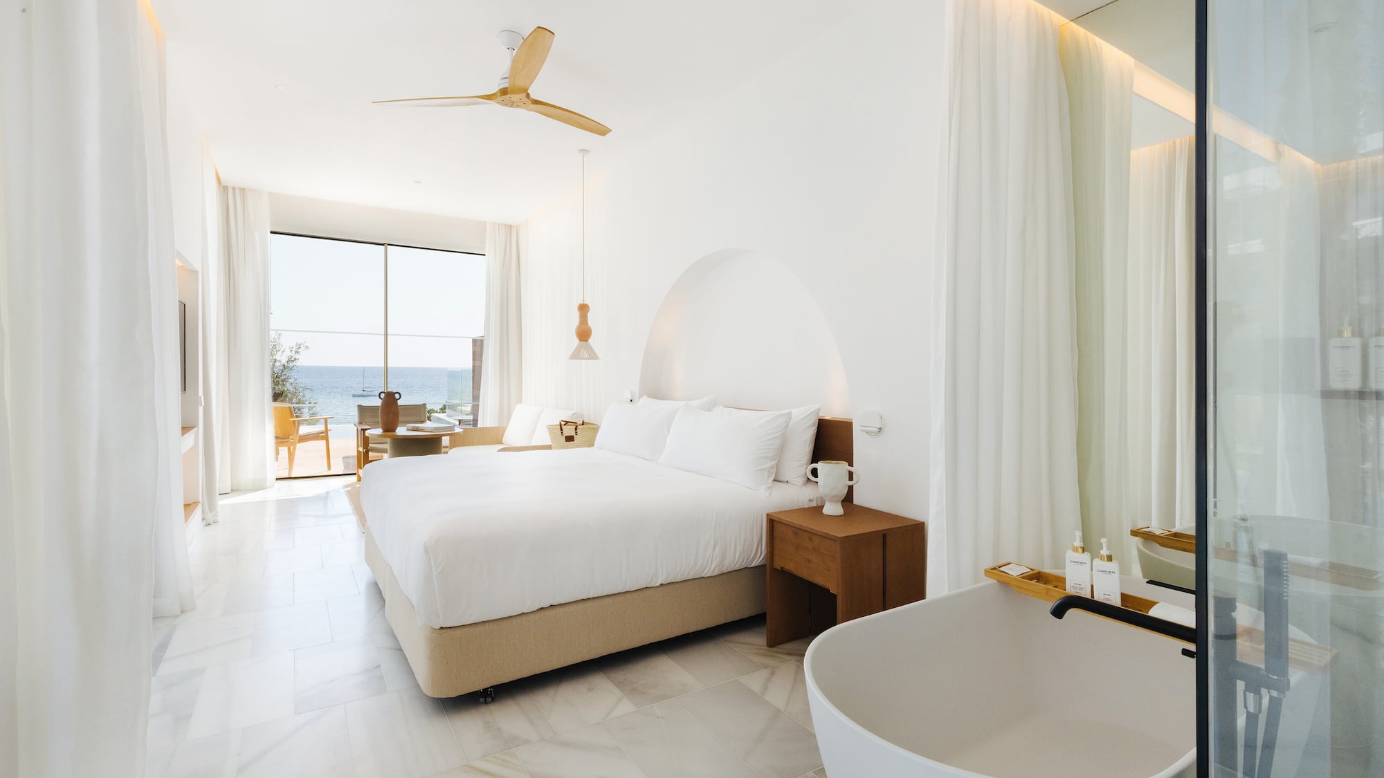 a room with a bed and bathtub