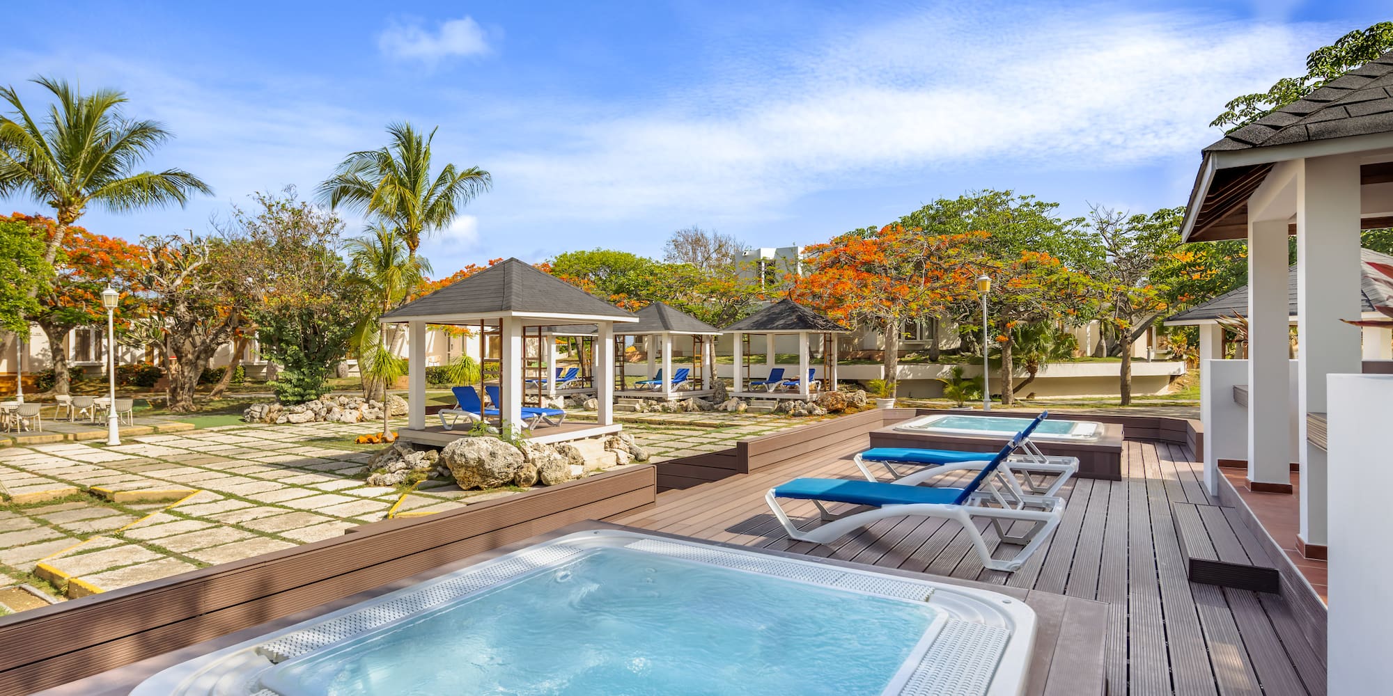 a hot tubs and a gazebo on a deck