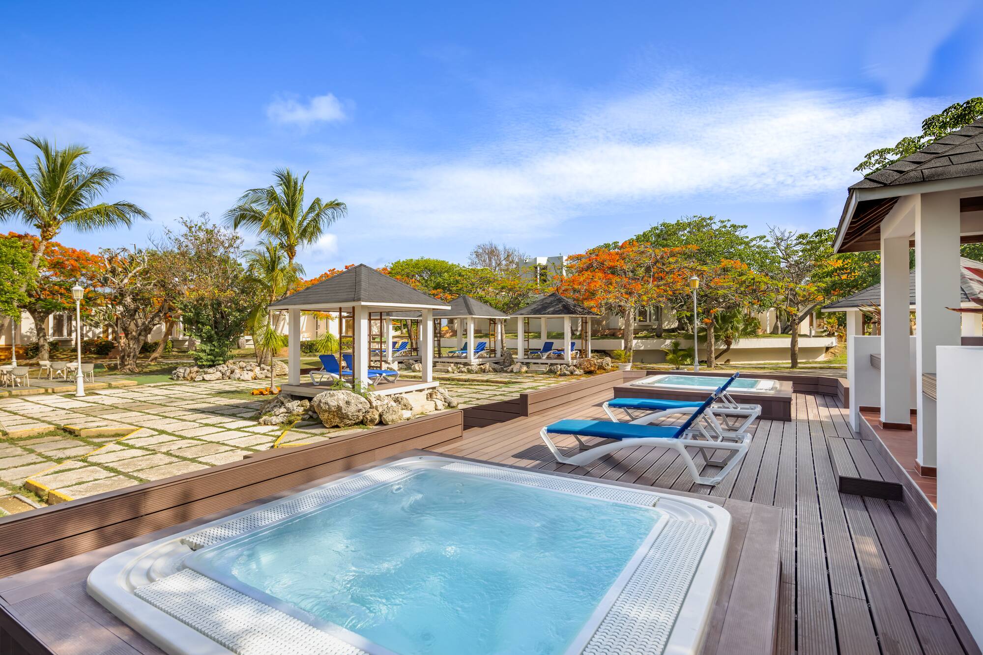 a hot tubs and a gazebo on a deck