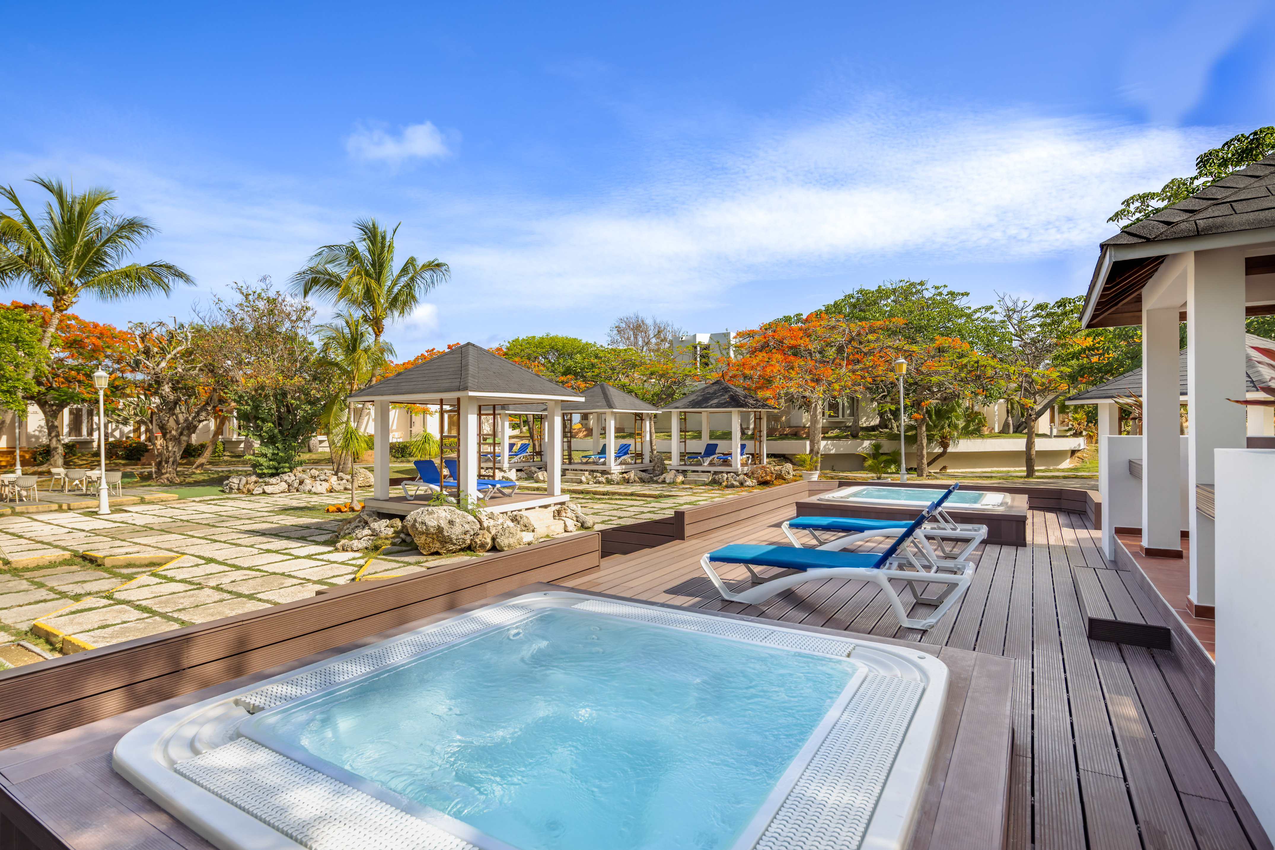 a hot tubs and a gazebo on a deck