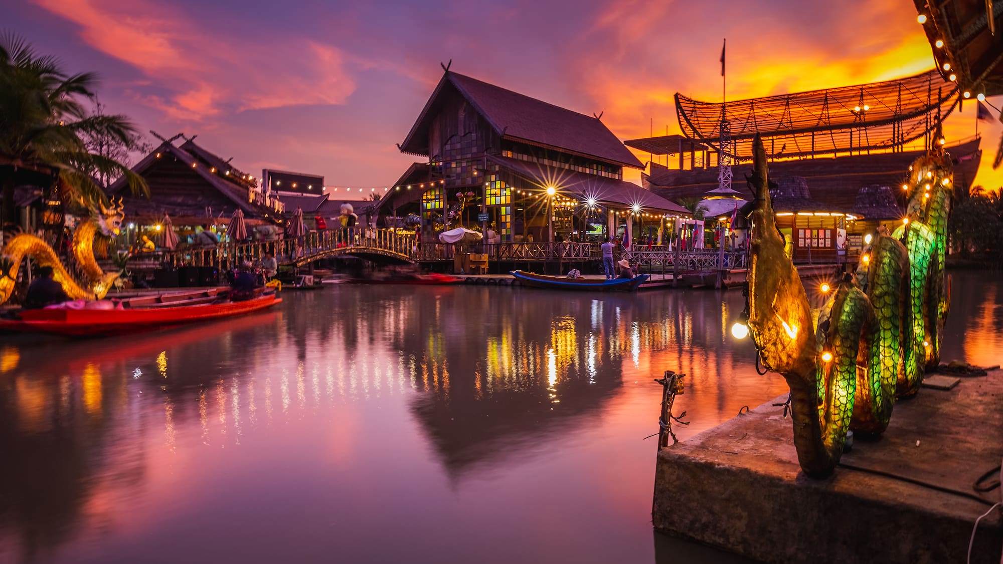 a water with boats and buildings in the background