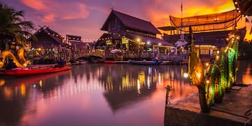 a water with boats and buildings in the background