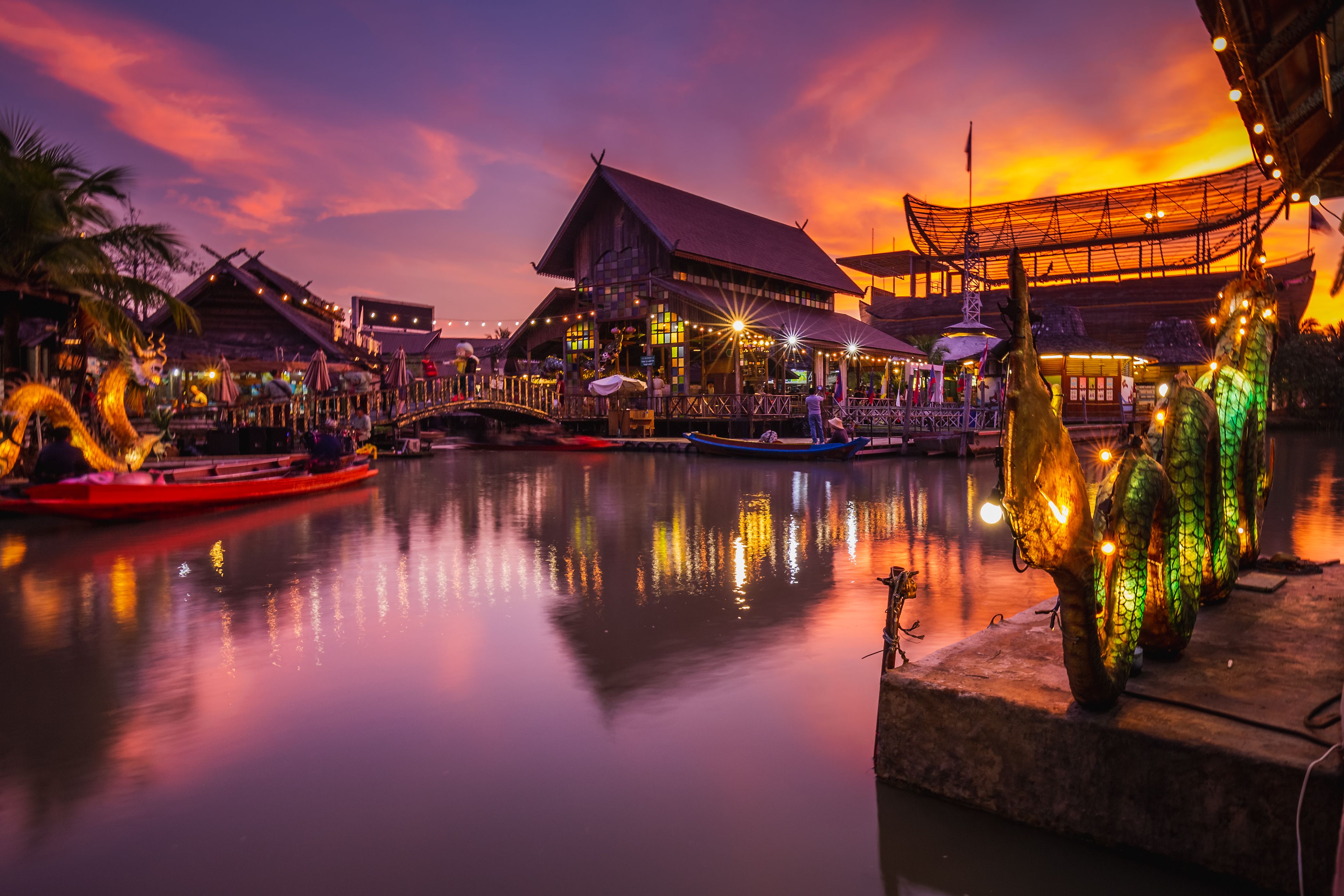 a water with boats and buildings in the background