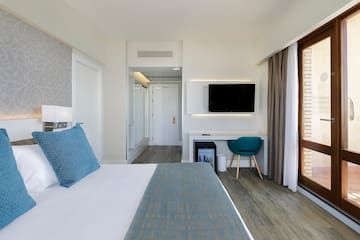 a room with a bed and a tv