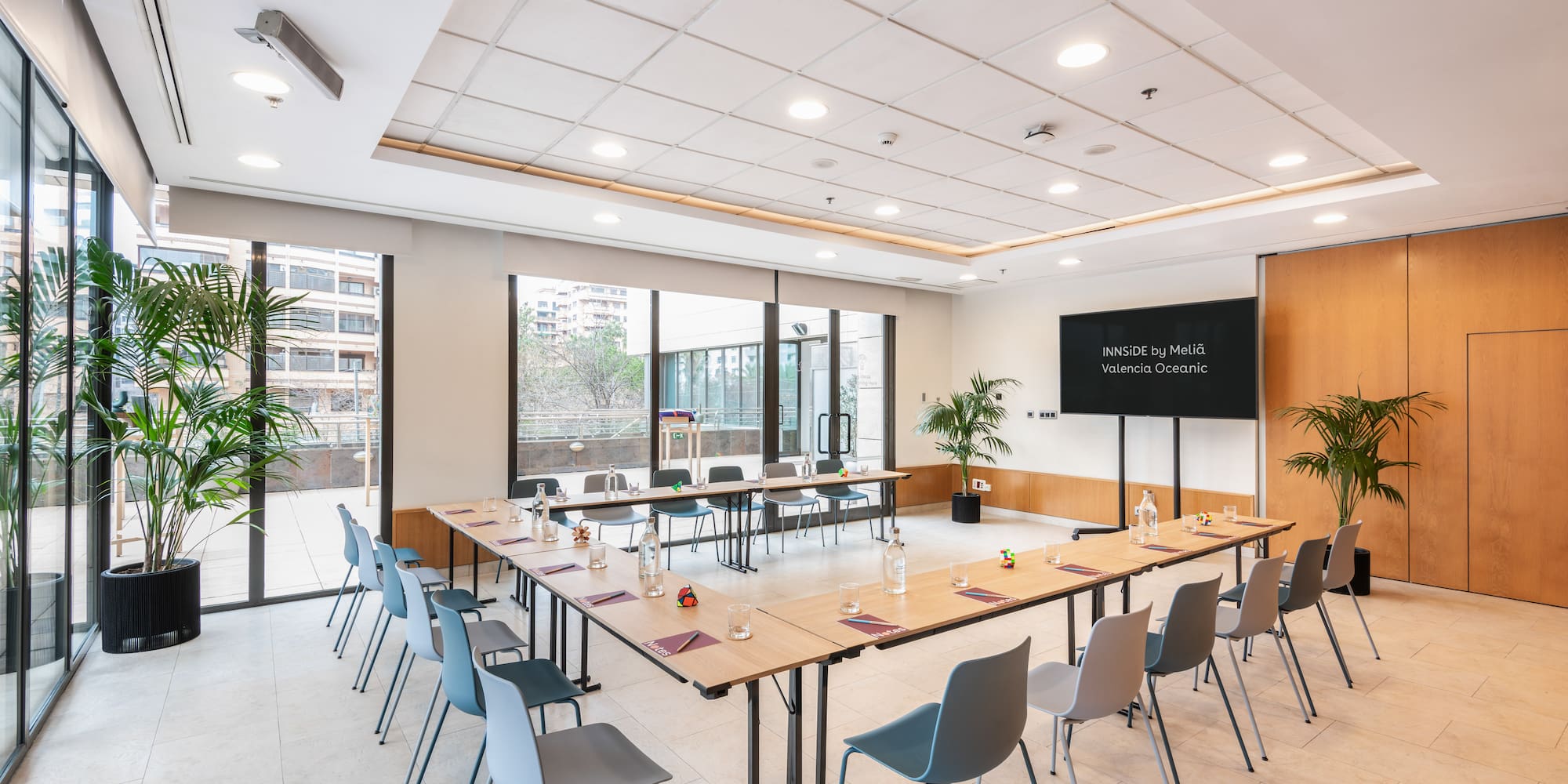 a room with a long table and chairs