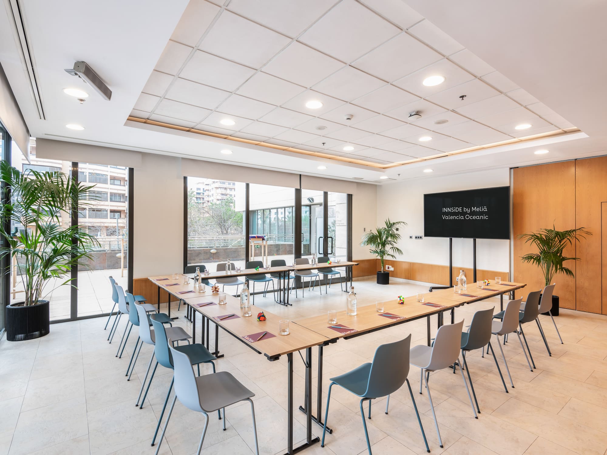 a room with a long table and chairs