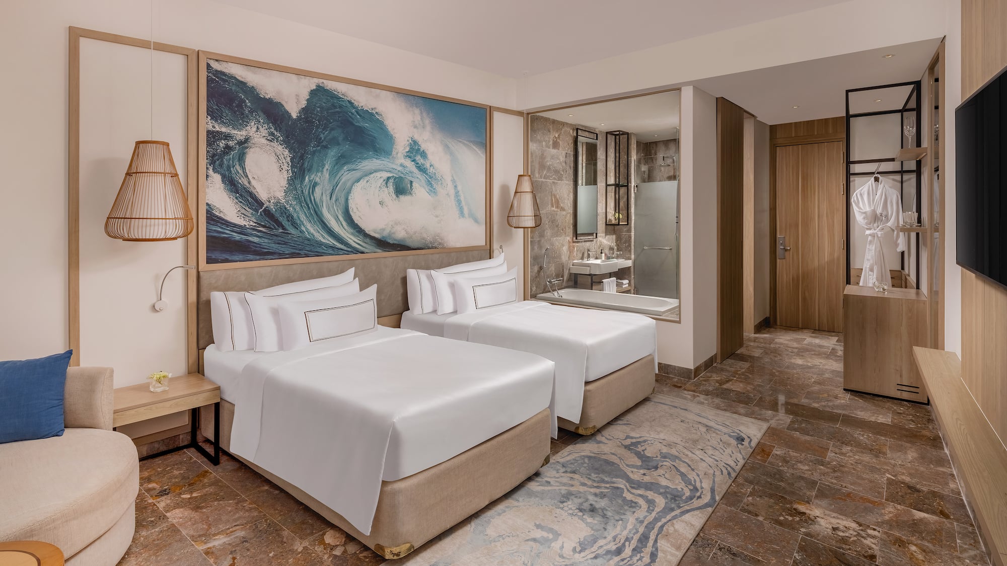 a room with two beds and a mirror