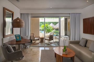 a living room with a glass door and a table