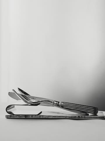 a silverware on a piece of wood