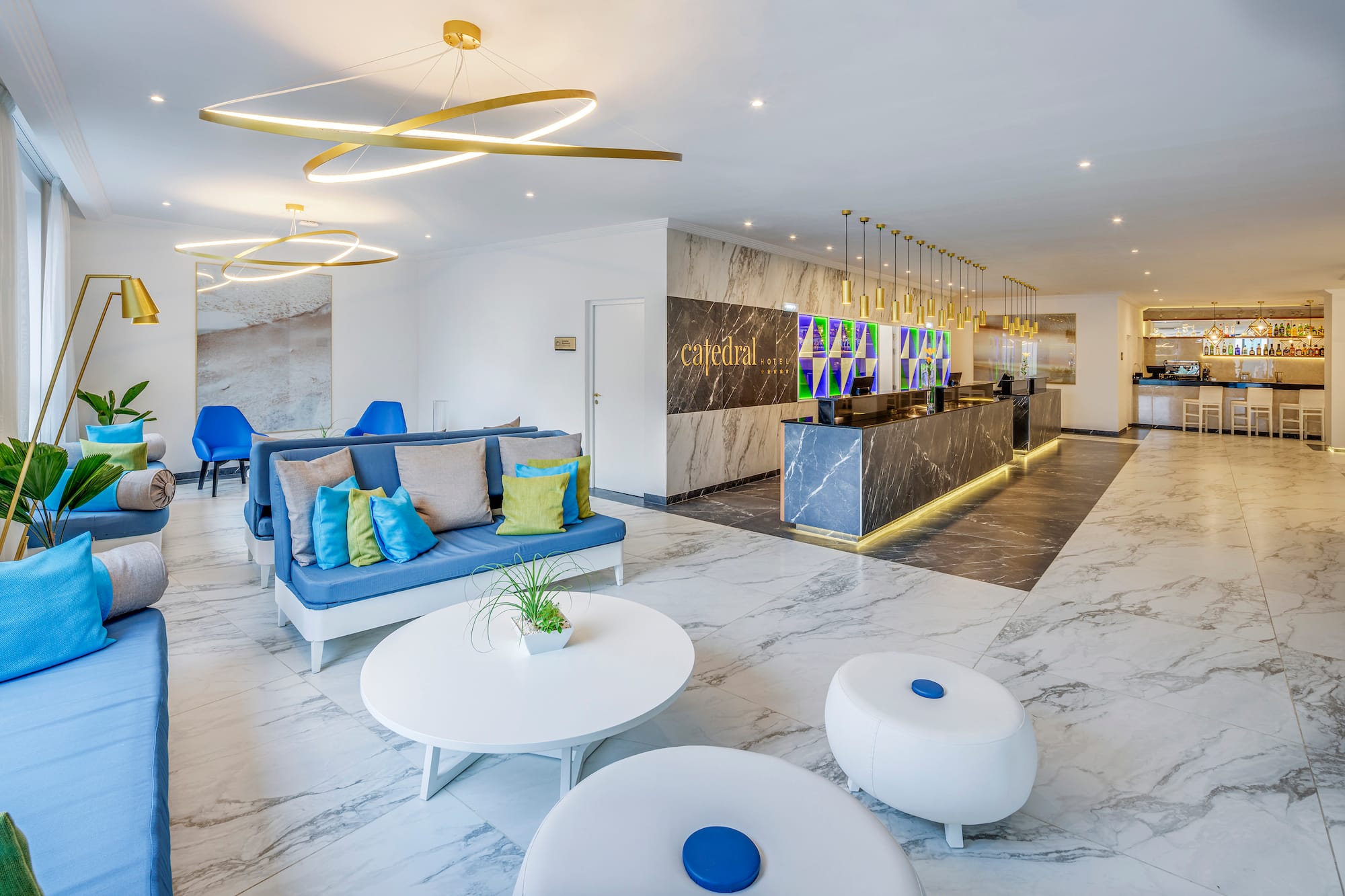 a lobby with a marble floor and a marble counter