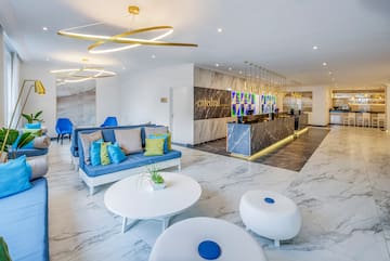 a lobby with a marble floor and a marble counter