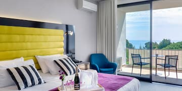 a room with a bed and a glass door