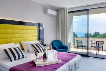 a room with a bed and a glass door