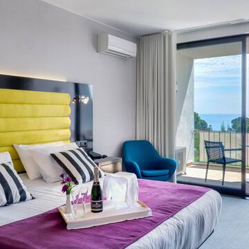 a room with a bed and a glass door