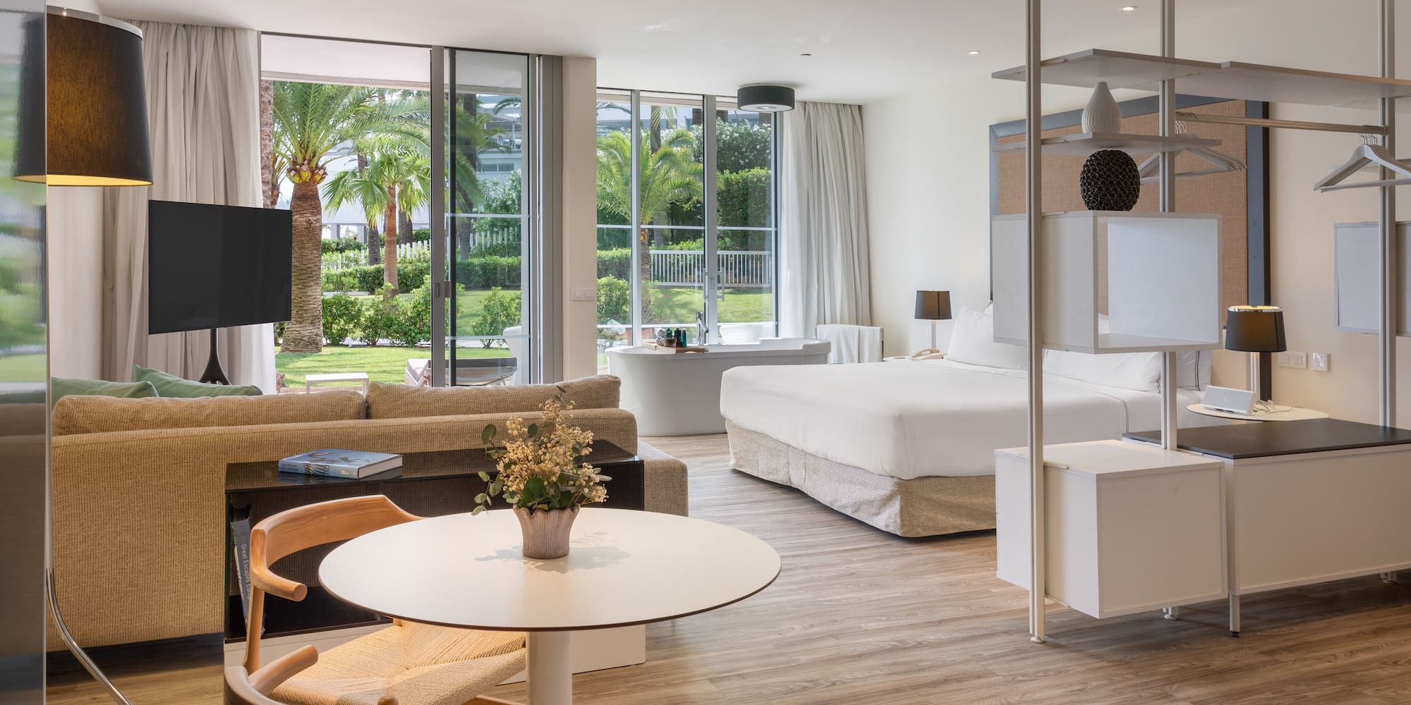 a room with a bed and a television