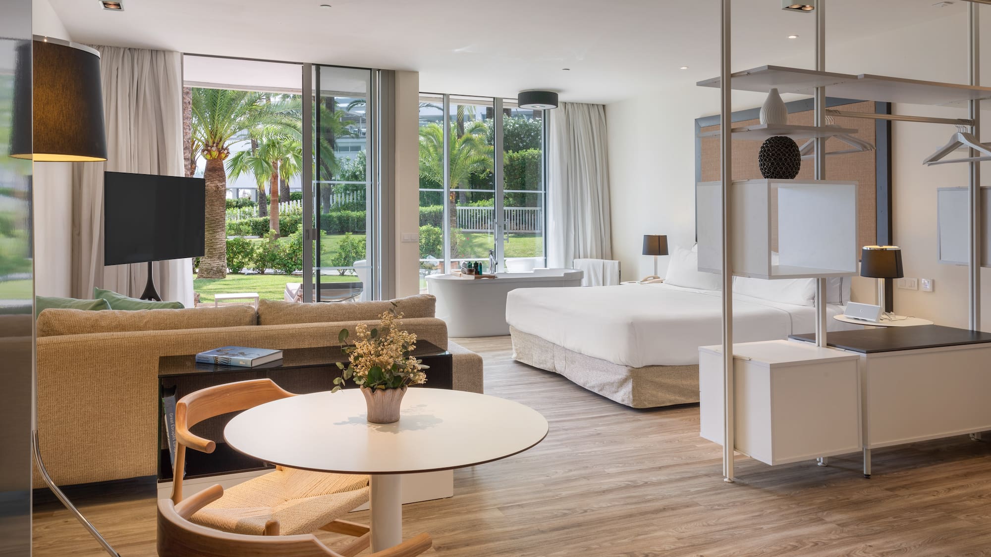 a room with a bed and a television