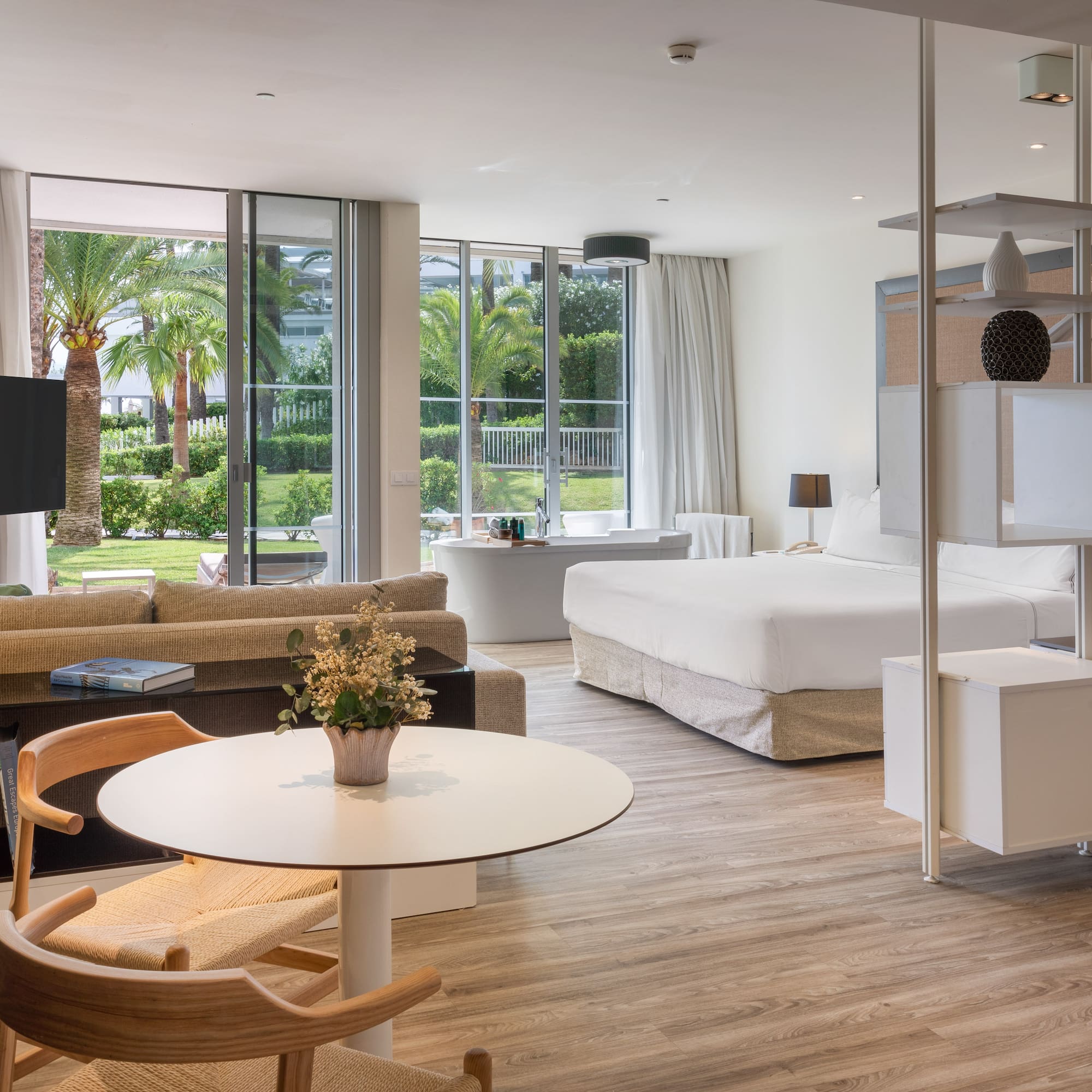 a room with a bed and a television