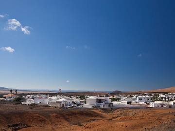 a white buildings in a desert