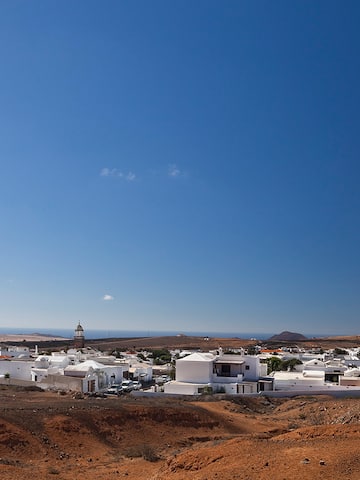 a white buildings in a desert