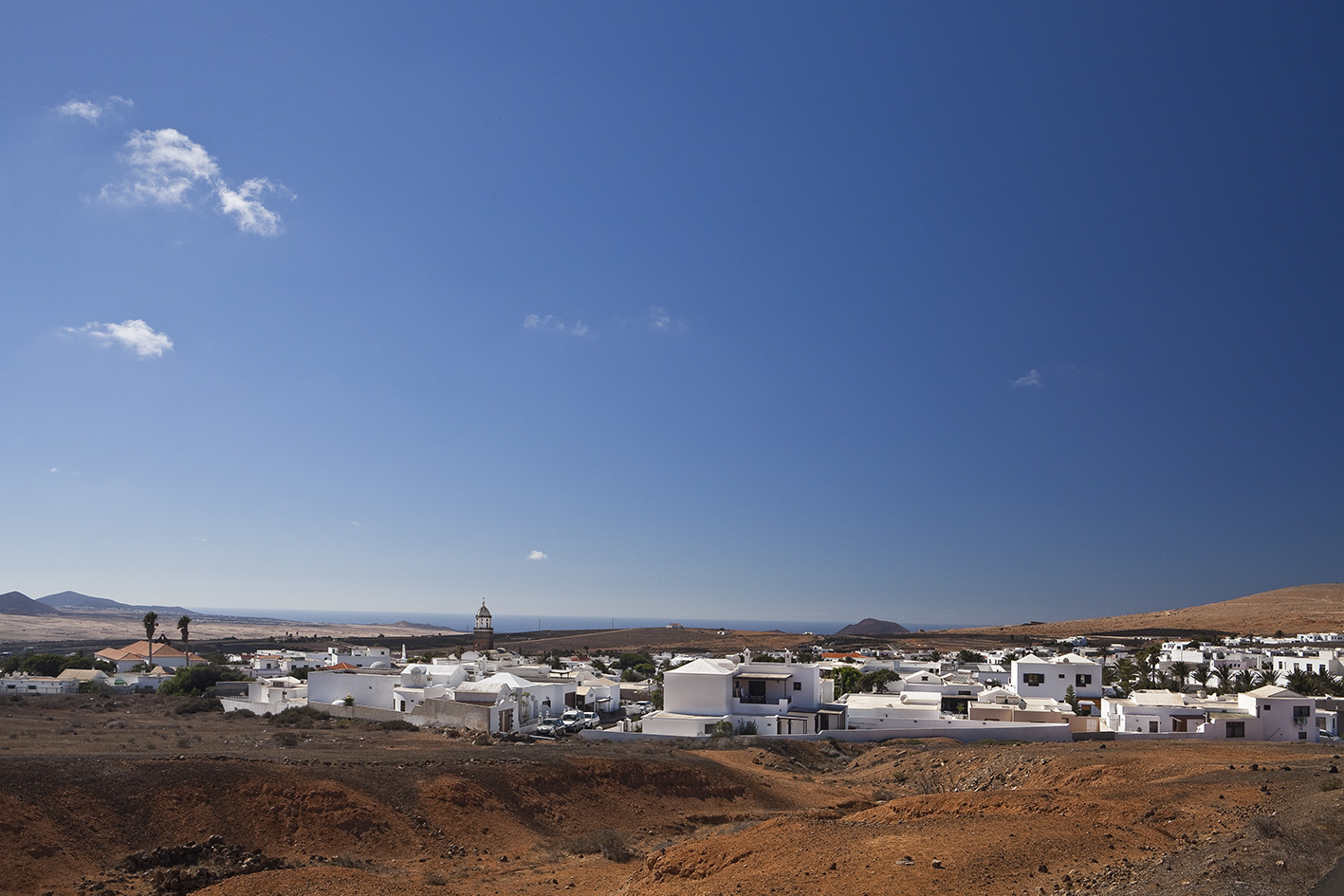 a white buildings in a desert