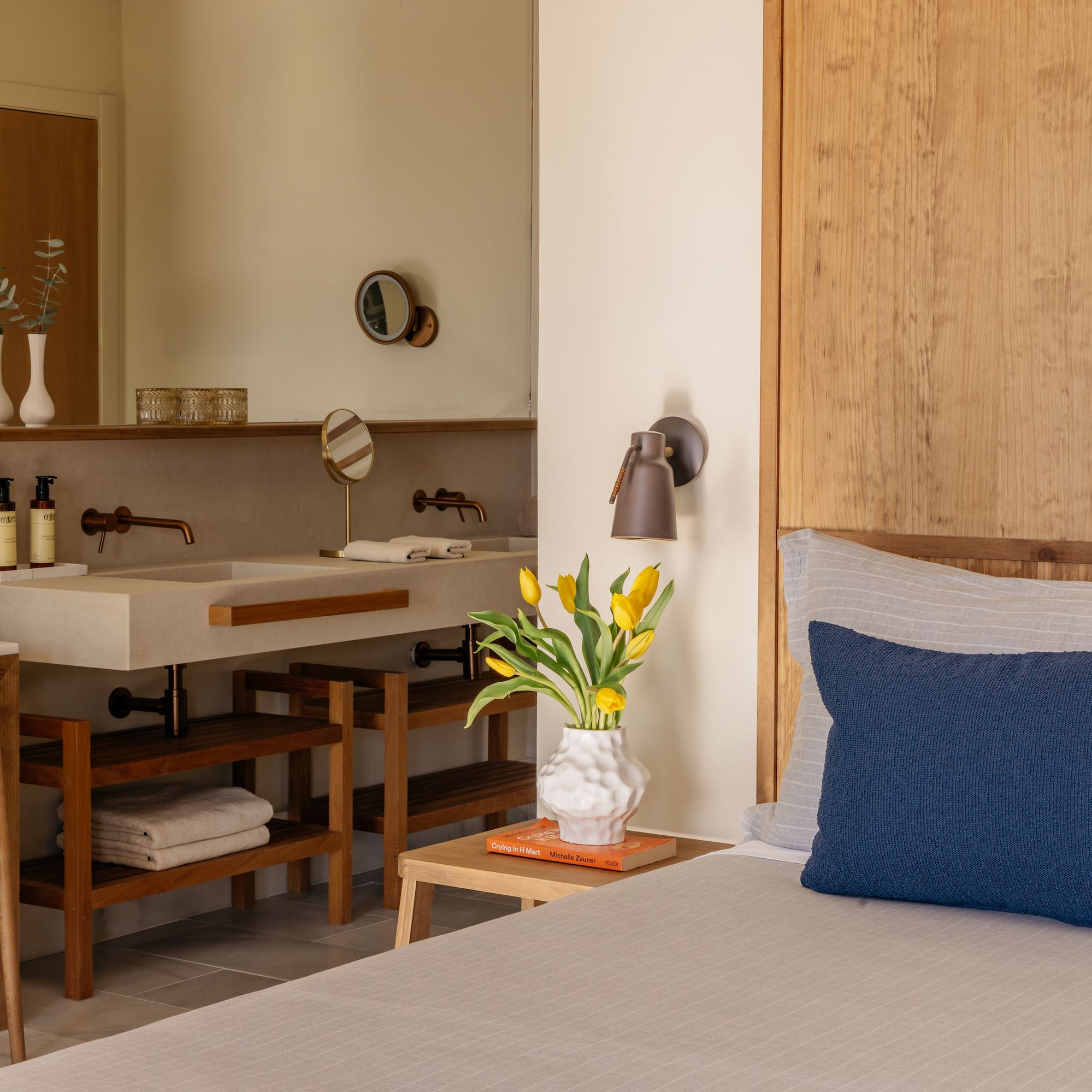 a room with a bed and sink