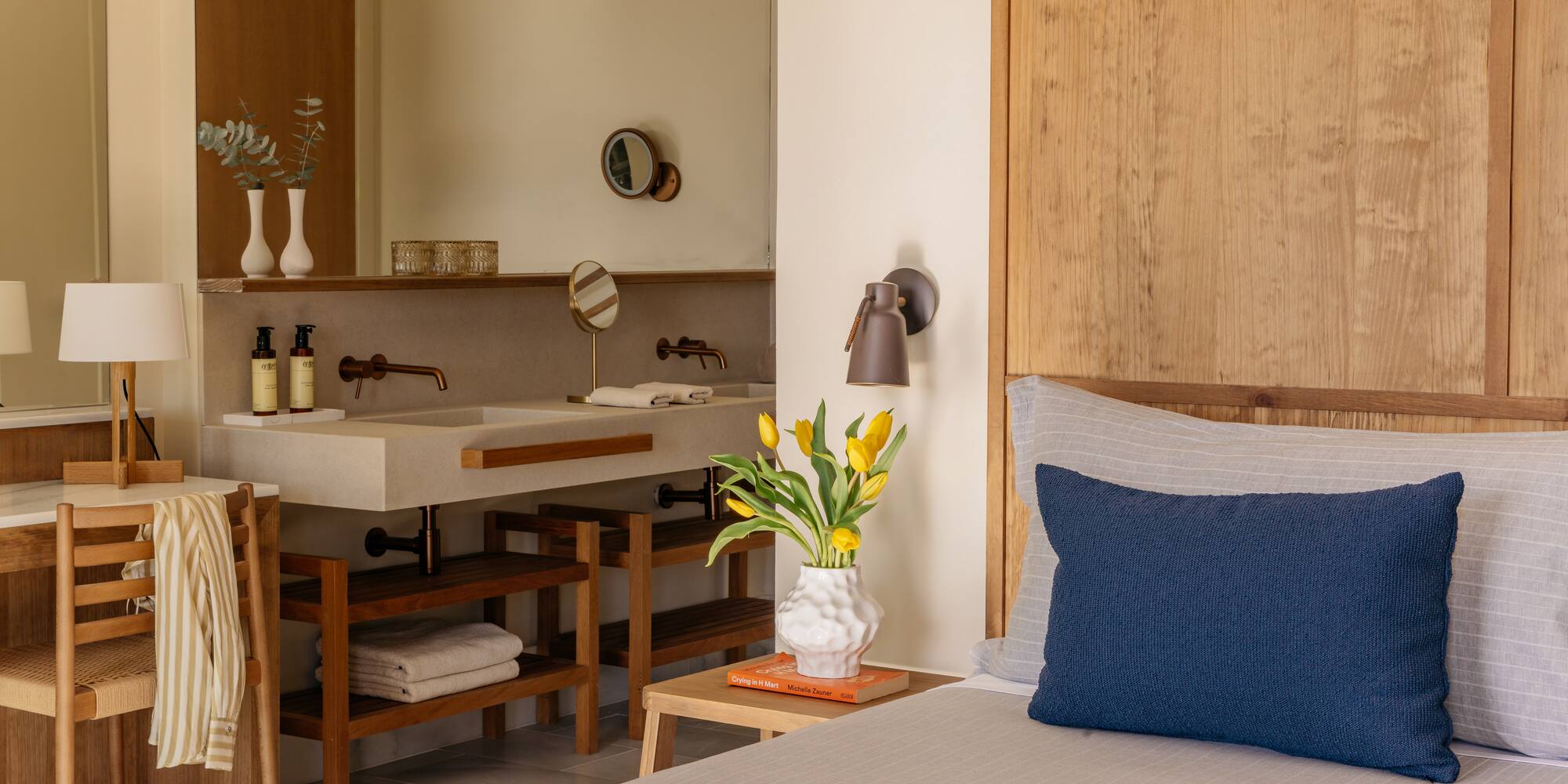 a room with a bed and sink