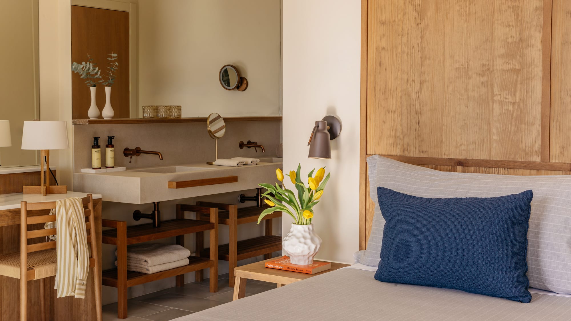 a room with a bed and sink