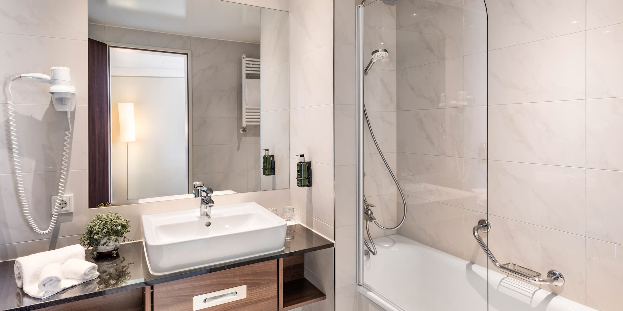 a bathroom with a sink and a shower