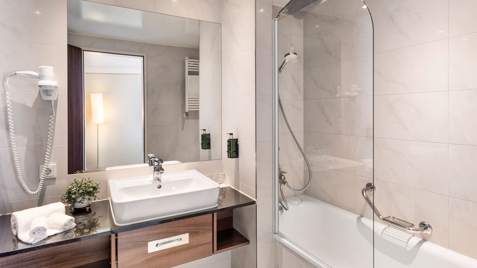 a bathroom with a sink and a shower