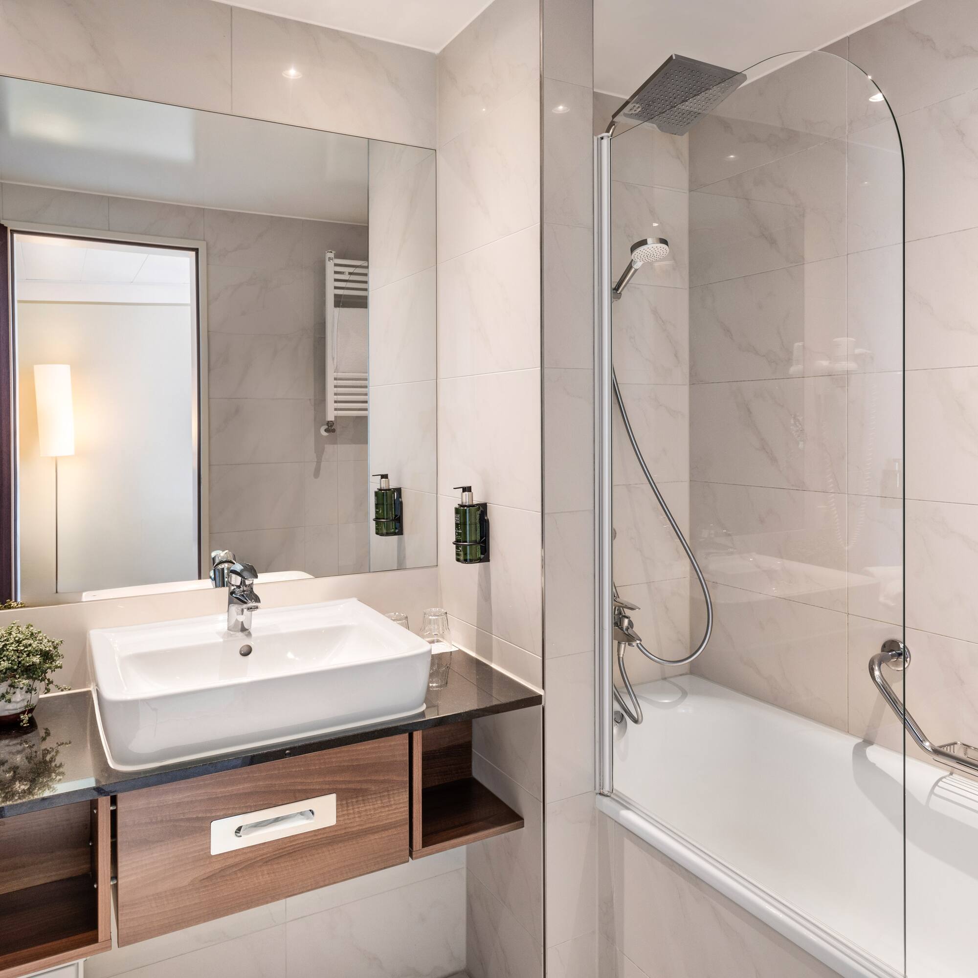 a bathroom with a sink and a shower