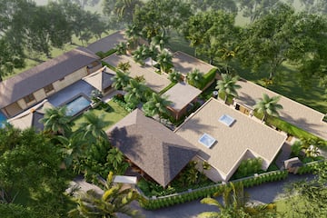a aerial view of a house with a pool and trees