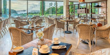a restaurant with tables and chairs