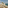 Coastal terrace with ocean view, sun loungers, outdoor dining, and cacti.