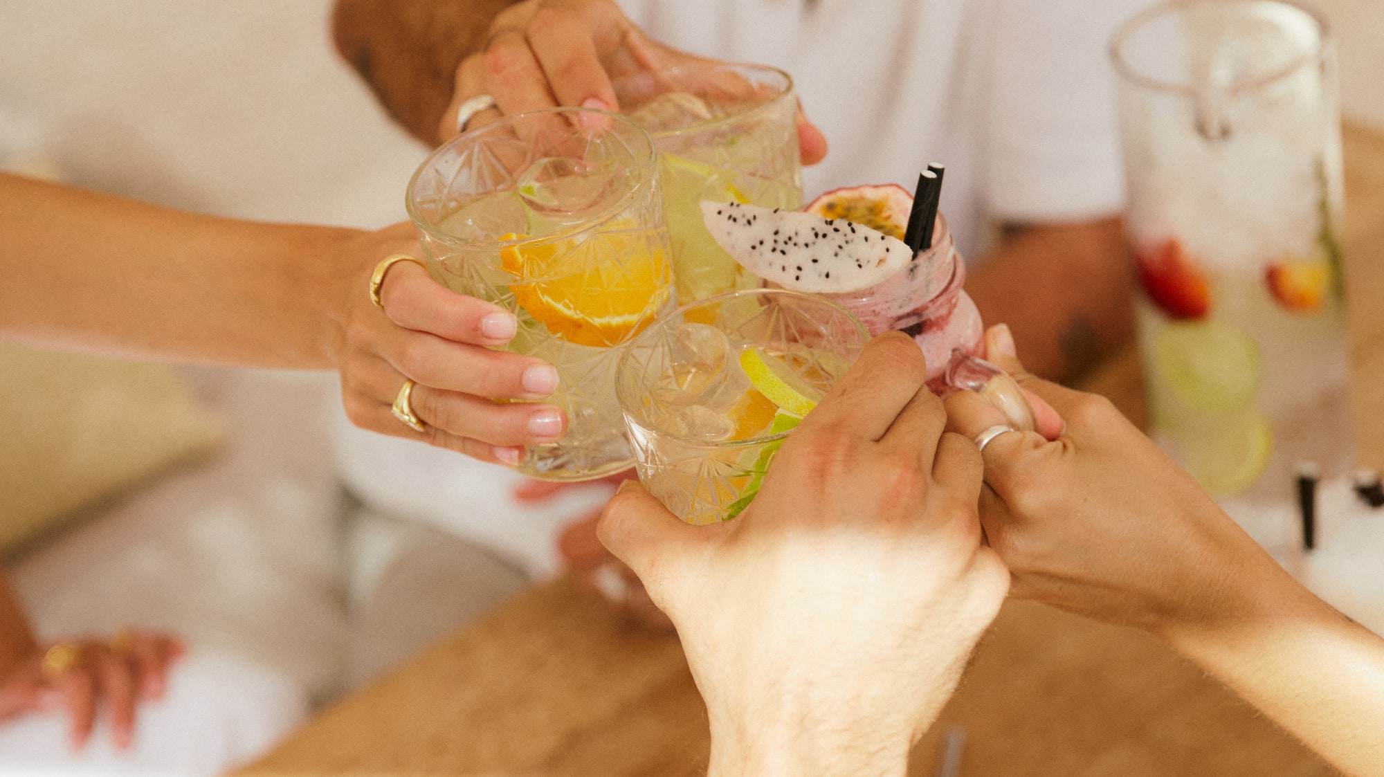 a group of people clinking glasses