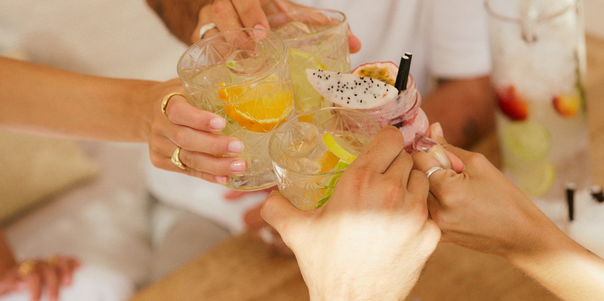 a group of people clinking glasses