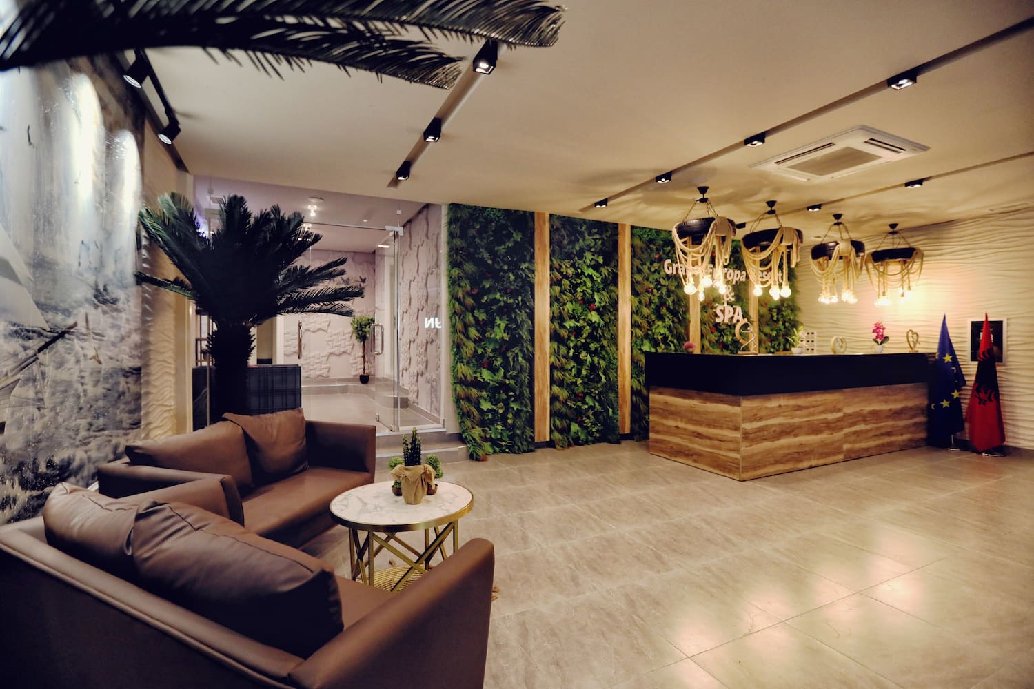 a lobby with a reception desk and plants