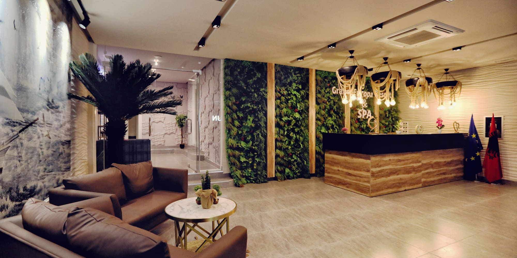 a lobby with a reception desk and plants