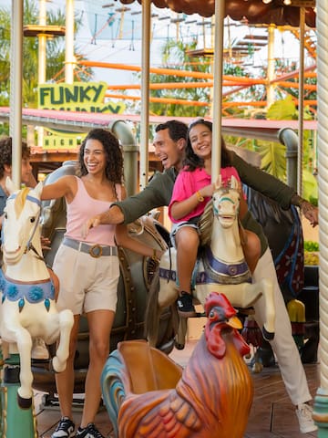 a group of people on a carousel