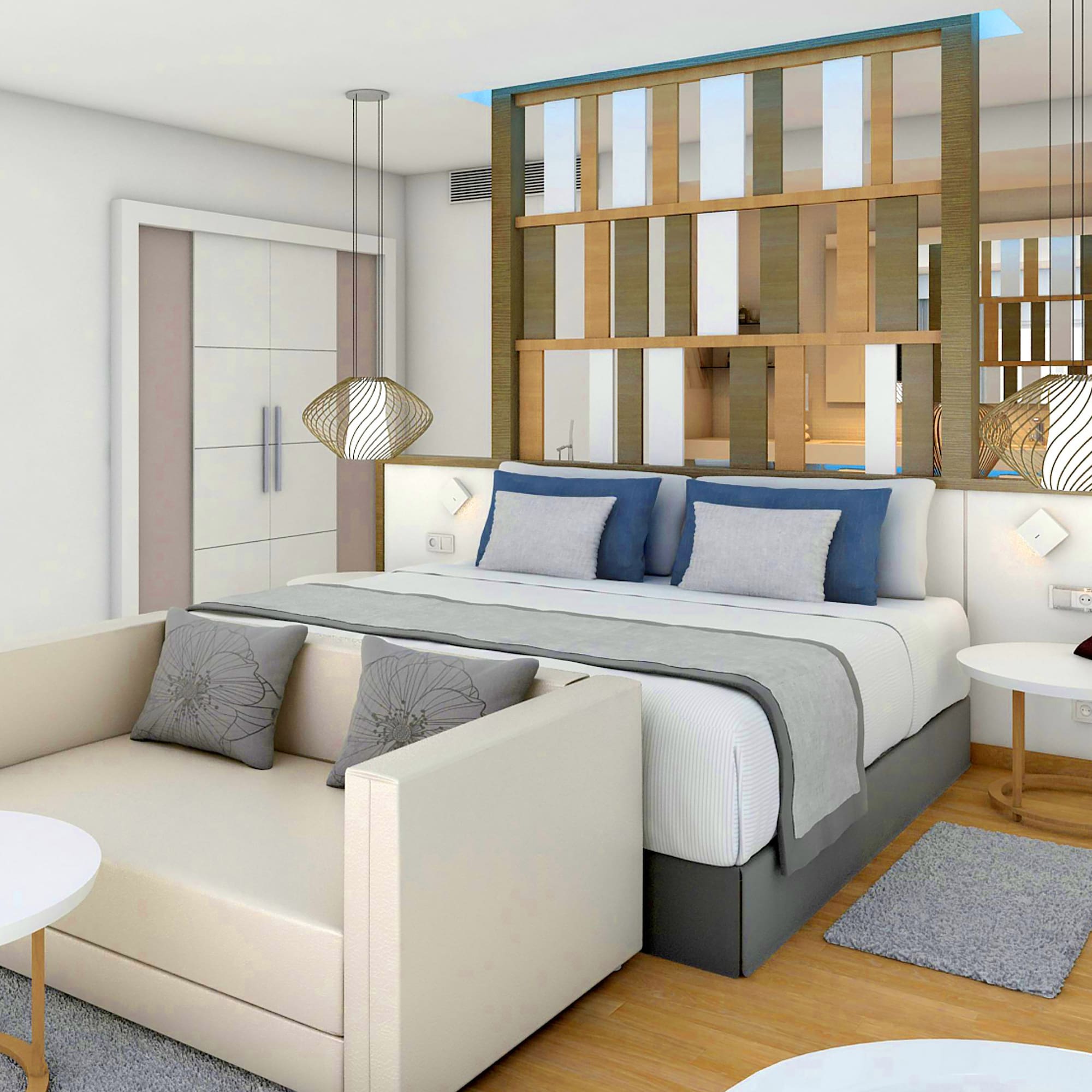 a bedroom with a bed and a couch