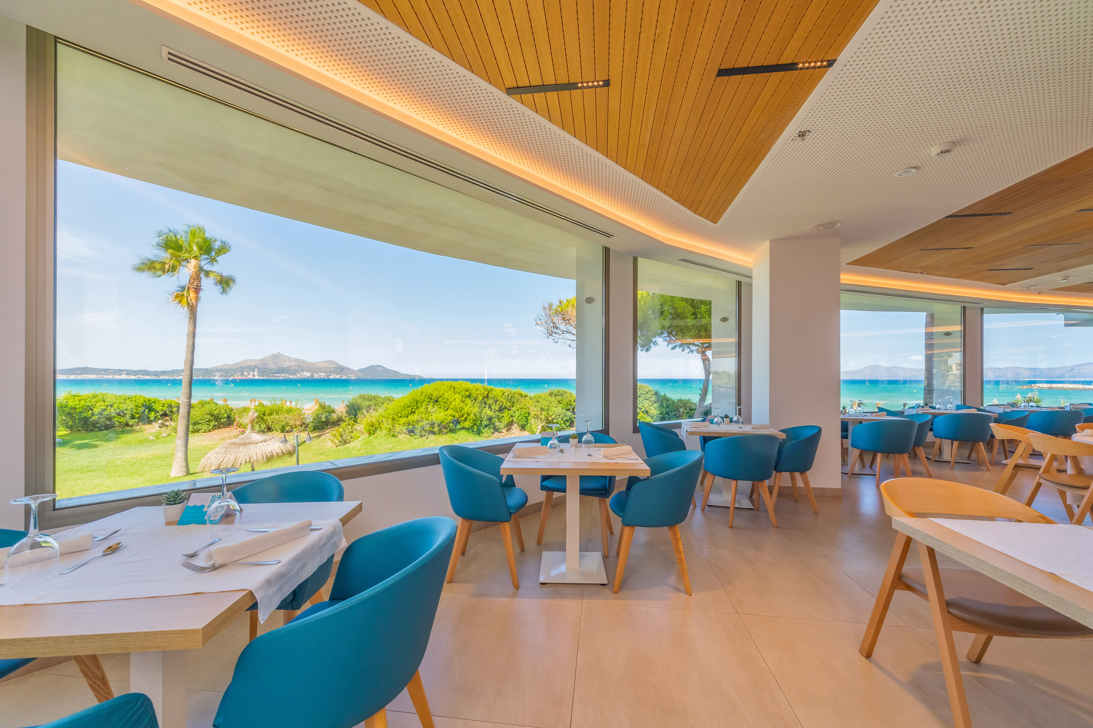 a restaurant with tables and chairs
