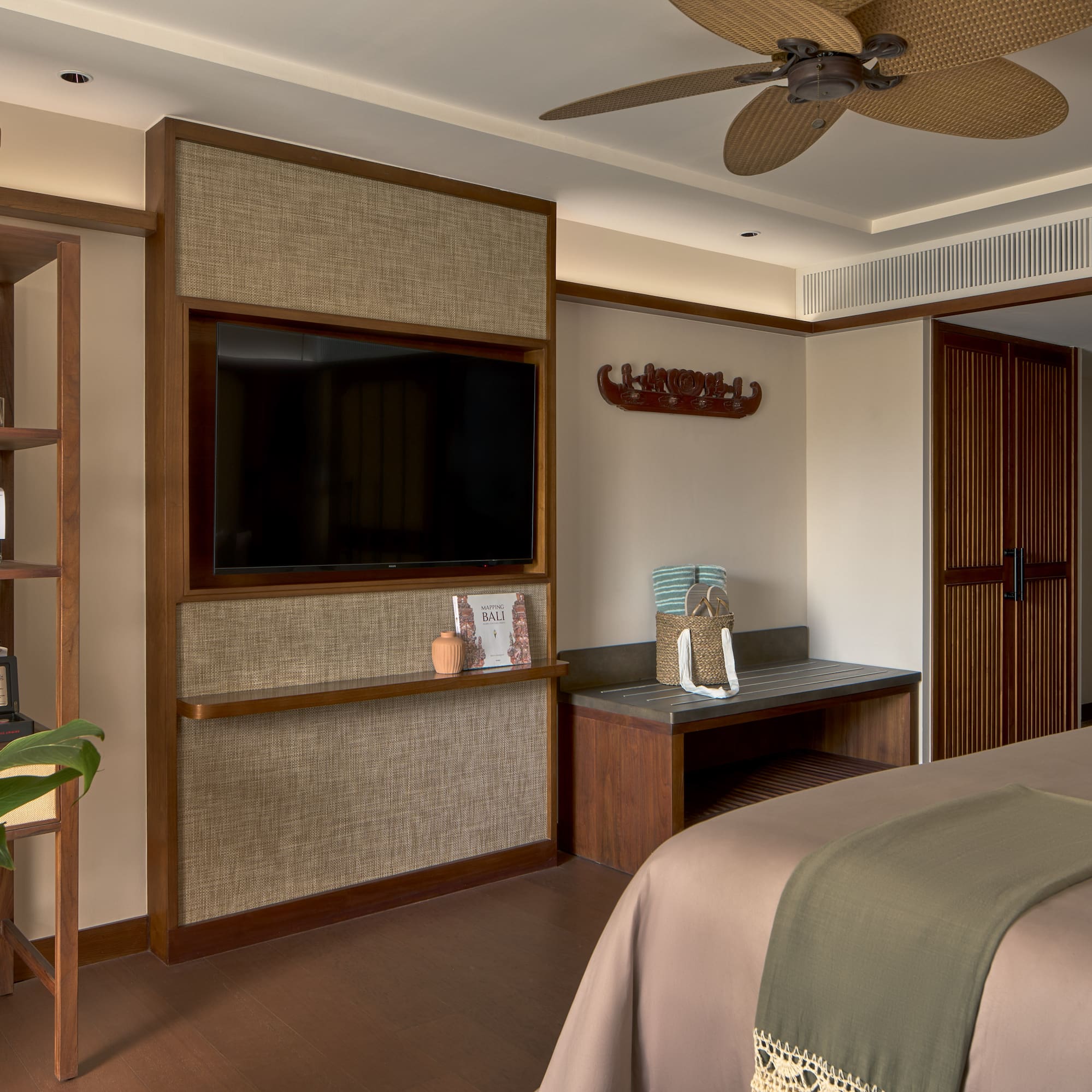 a room with a bed and a tv