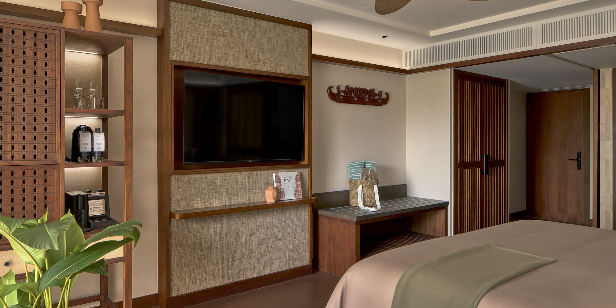 a room with a bed and a tv