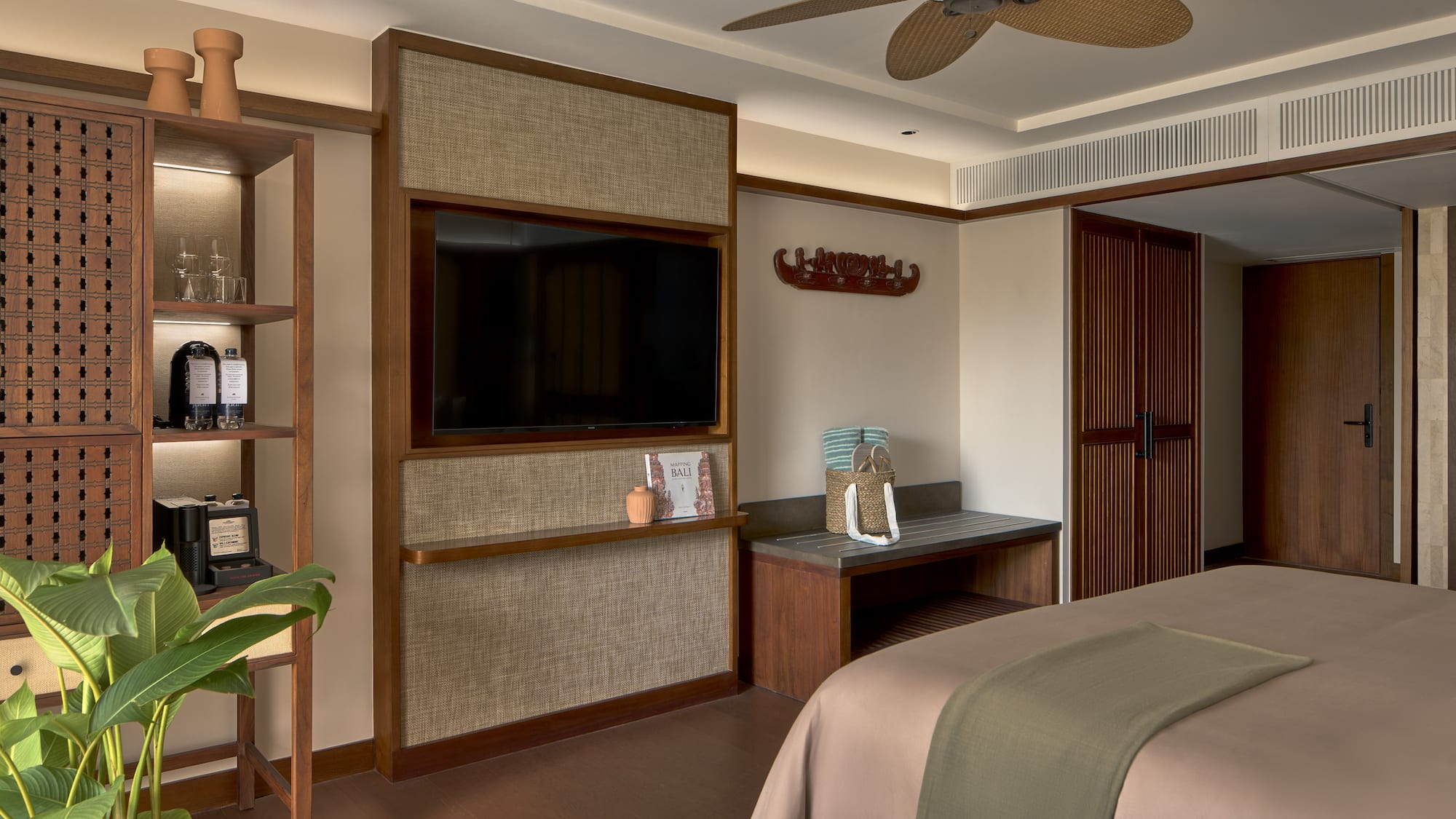 a room with a bed and a tv